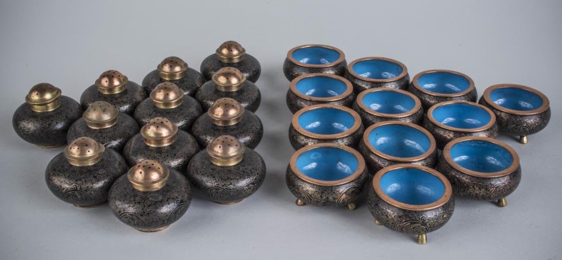 Group of Chinese Cloisonne Shakers & Salt Cellars: Comprising twelve sets. Salt cellar, diameter 1 3/4 inches, shaker, height 1 1/2 inches. Notice to bidders: Condition reports and additional photographs are provided by request as a courtesy to our cl