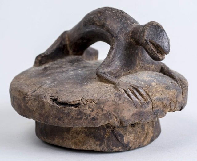 Carved Wooden Lid: Circa 20th Century. With lizard form handle. Height 4 1/2 inches, diameter 6 inches. Notice to bidders: Condition reports and additional photographs are provided by request as a courtesy to our client
