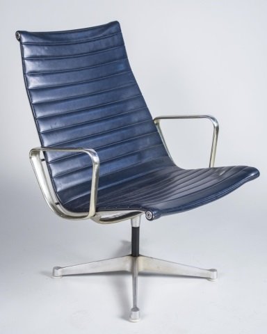 Eames Herman Miller Aluminum Group Lounge Chair: Open arms, blue upholstery on four pronged base. Height 35 inches, width 25 inches, depth 25 inches. Notice to bidders: Condition reports and additional photographs are provided by request as a courte