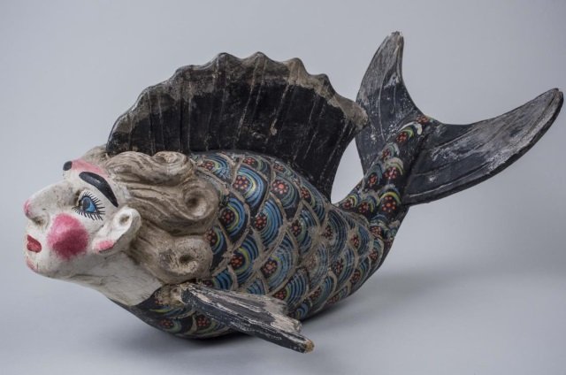 Mexican Wood and Plaster Sculpture: ManFish. Circa 1960's. Height 12 inches, width 17 inches, length 23 inches. Notice to bidders: Condition reports and additional photographs are provided by request as a courtesy to our clients, as suc