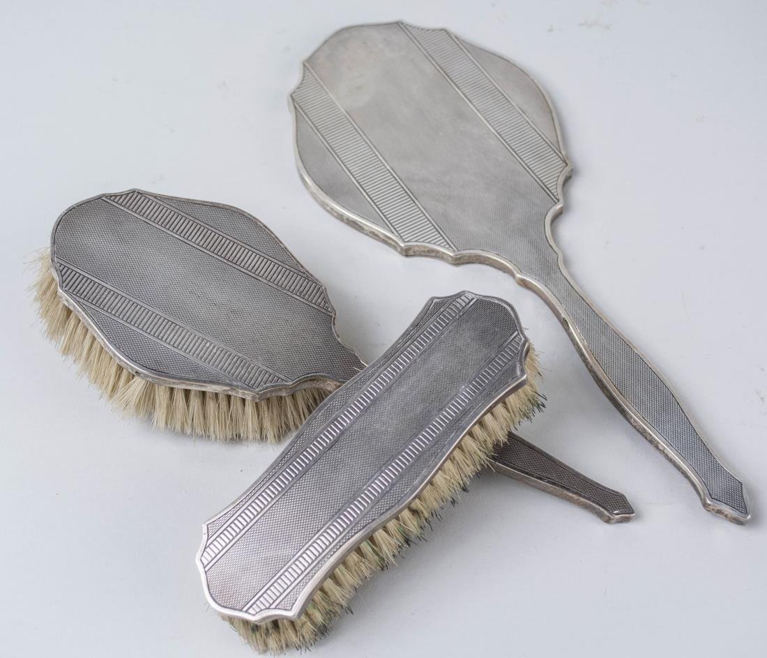 Sterling Silver Three Piece Dresser Set: Hair brush, hand mirror and clothes brush, marked Argentina 925. Notice to bidders: Condition reports and additional photographs are provided by request as a courtesy to our clients, as such any condi