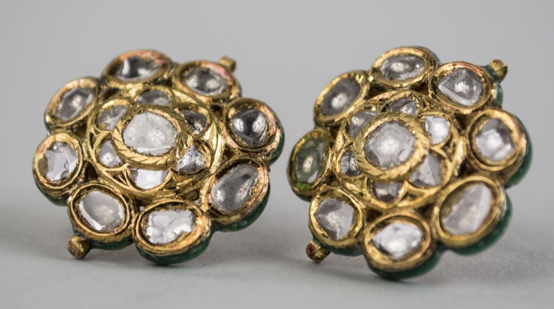 Pair of Mughal High Carat Diamond Earrings *: Set with flat cut diamonds, the back with elaborate enamel decoration. Diameter 7/8 inch. Notice to bidders: Condition reports and additional photographs are provided by request as a courtesy to our c