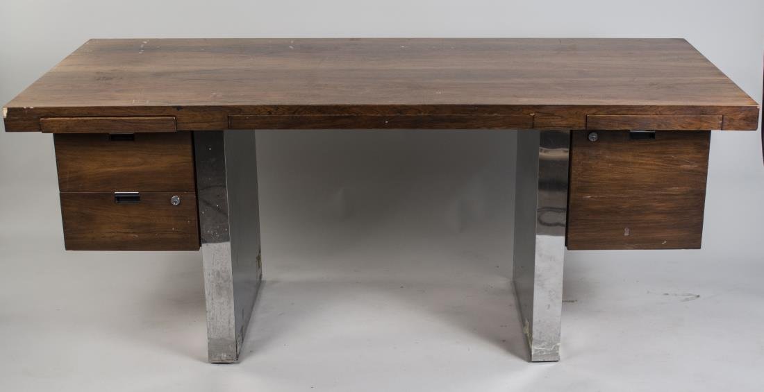 Executive Desk: Rectangular top on two metal clad supports flanked by drawers and slides. Height 29 inches, width 72 inches, depth 32 inches. Notice to bidders: Condition reports and additional photographs are provid