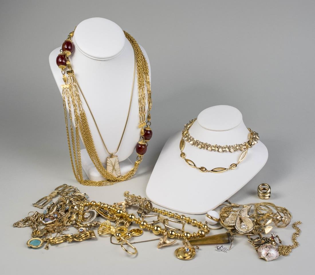 Group of Gold Tone Jewelry: Some signed including Trifari, Boucher, Caravel, Monet. etc. Notice to bidders: Condition reports and additional photographs are provided by request as a courtesy to our clients, as such any condition