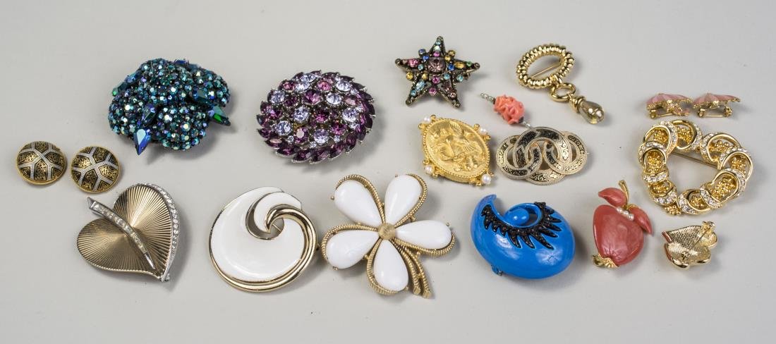 Group of Fashion Brooches: Including Monet, Warner, Boucher, Trifari, two flag pins,etc. Notice to bidders: Condition reports and additional photographs are provided by request as a courtesy to our clients, as such any conditio
