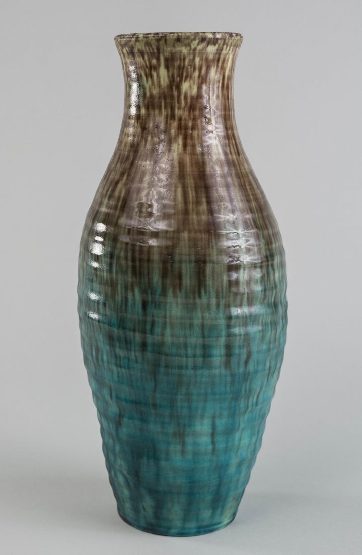 French Accolay Art Pottery Vase: Circa 1950, everted rim, waisted neck, tapered ovoid body with brown fading to teal glaze, signed on the bottom. Height 12 1/2 inches. Notice to bidders: Condition reports and additional photographs a