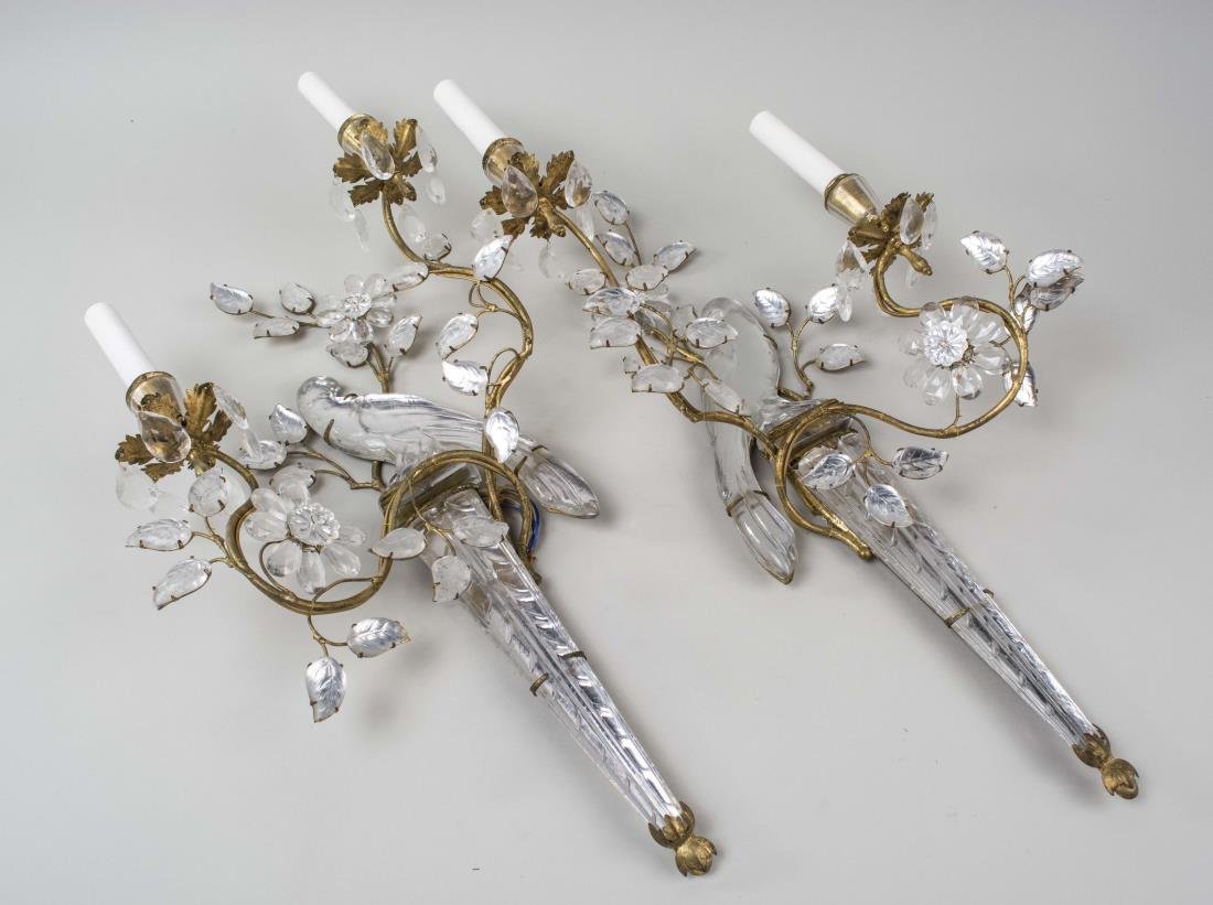 Pair of Bagues Sconces: Two light sconces decorated with a bird and flowering branches. Height 25 inches. Notice to bidders: Condition reports and additional photographs are provided by request as a courtesy to our clients, 