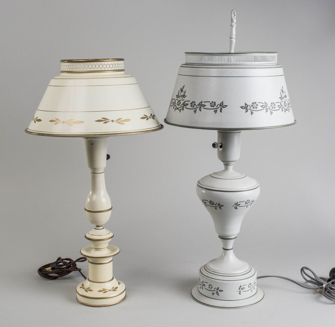 Two Tole Lamps: White painted lamps with tole shades. Notice to bidders: Condition reports and additional photographs are provided by request as a courtesy to our clients, as such any condition report is only an opin