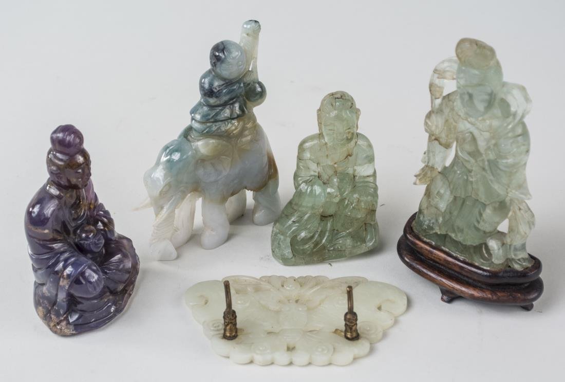 Group of Rock Crystal, Jade and Soapstone Figures: Including two seated figures, a man riding an elephant, etc. Man on elephant, height 4 1/4 inches. Notice to bidders: Condition reports and additional photographs are provided by request as a courtesy
