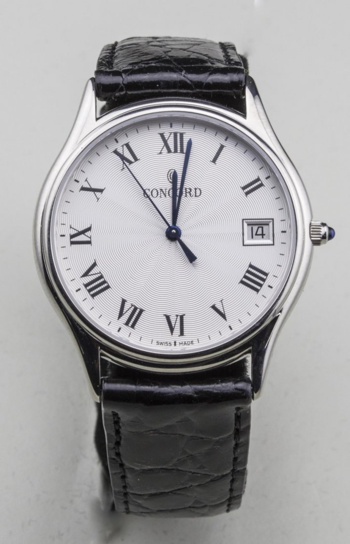 Concord Watch: Guilloche enamel dial with Roman numerals and date aperture, no.1236284, back crocodile band. Notice to bidders: Condition reports and additional photographs are provided by request as a courtesy to o