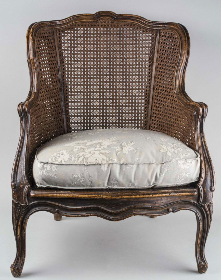 Caned Bergere: Floral upholstered cushion seat. Height 33 inches, width 23 inches, depth 23 inches. Notice to bidders: Condition reports and additional photographs are provided by request as a courtesy to our client