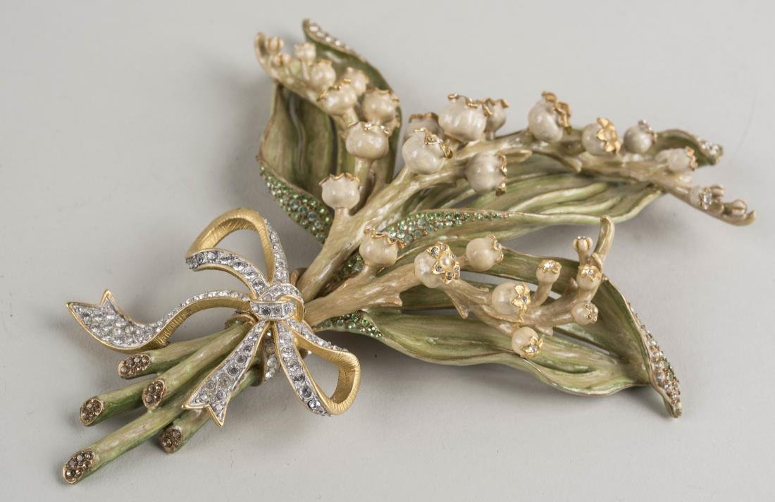 Jay Strongwater Lily of the Valley: Enamelled and jewelled flower, signed. Height 7 1/4 inches. Notice to bidders: Condition reports and additional photographs are provided by request as a courtesy to our clients, as such any condition 