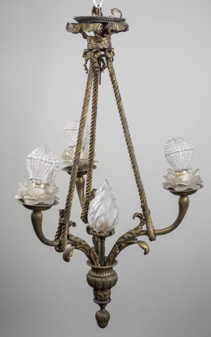Neoclassical Style Gilt Metal Hanging Light: Four scrolled arms, ending in frosted glass floriform shades and hung by three twisted ropes. Height 36 inches, width 20 inches. Notice to bidders: Condition reports and additional photographs are pro