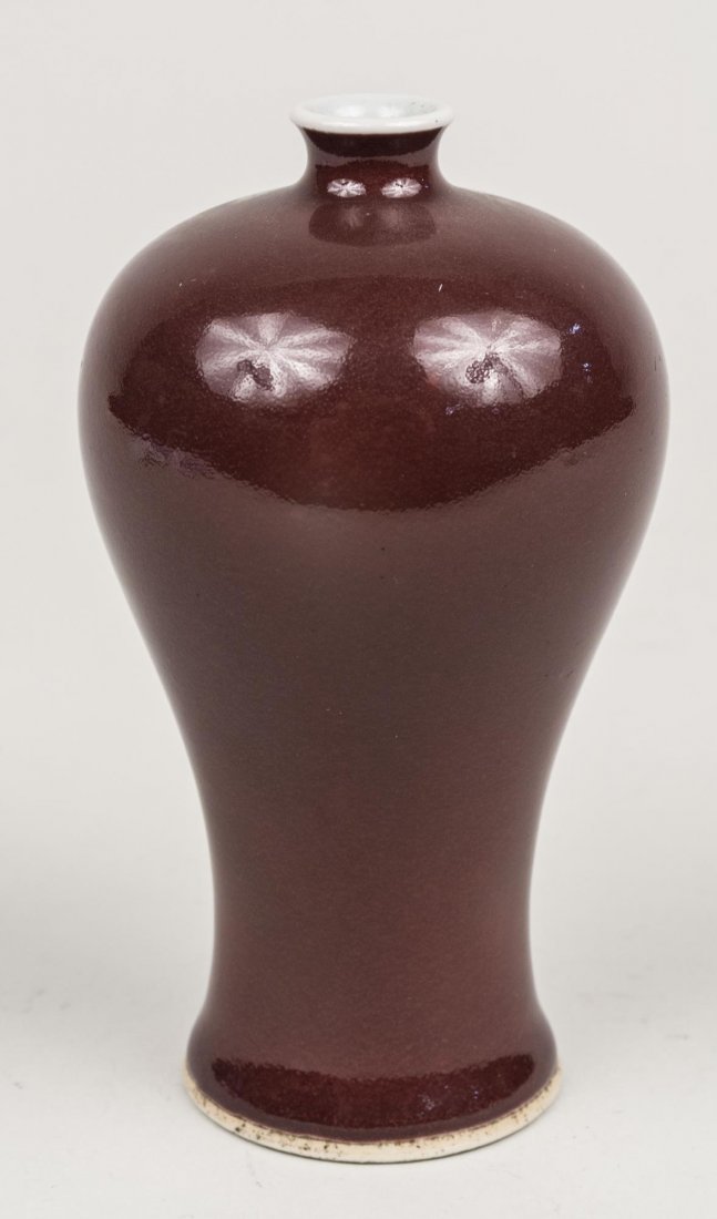 Chinese Porcelain Vase: Inverted baluster form, sang de boeuf glaze, signed on bottom. Height, 6 1/4 inches. Provenance: From the Collection of Erwin A. Raible Notice to bidders: Condition reports and additional photographs 