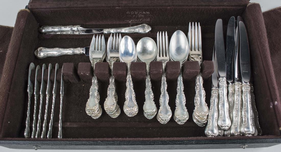 Gorham Sterling Silver Flatware Service: pattern, comprising twelve dinner knives, six dinner forks, six dessert forks, six table spoons, six cream soup spoons, twelve teaspoons, twelve salad forks, six butter spreaders. Total 2060 grams, we