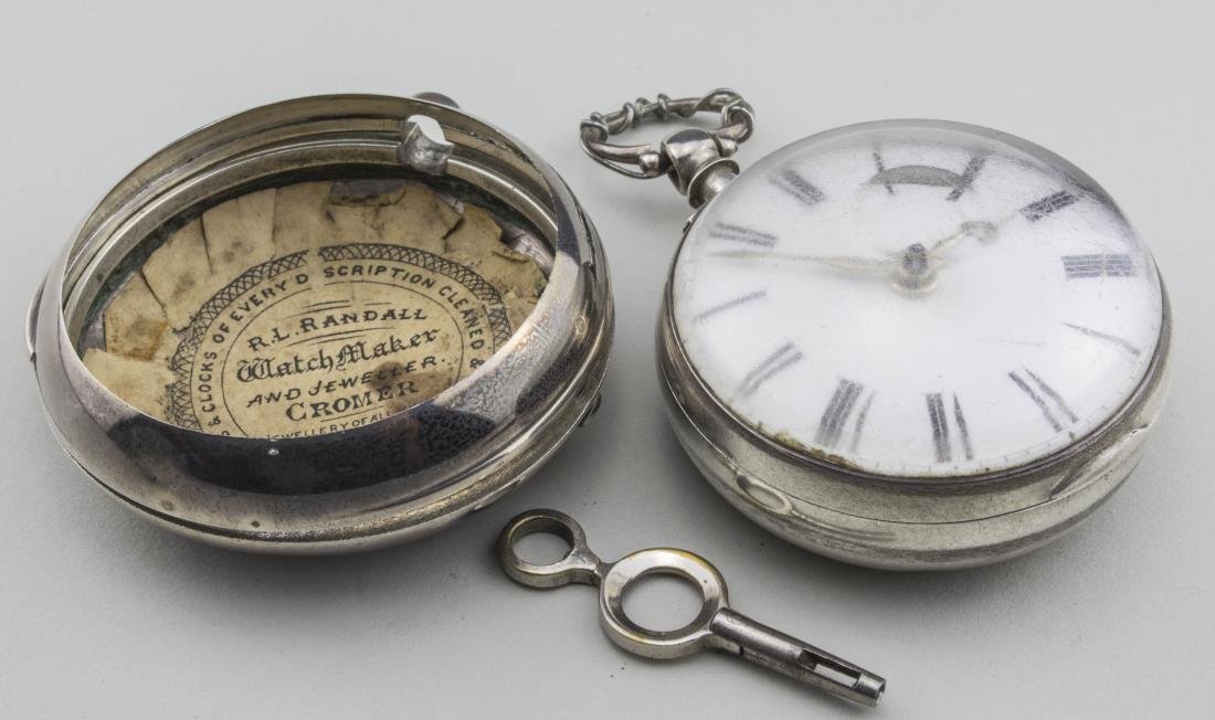 English Silver Double Case Key Wind Pocketwatch: Enamel dial with Roman numerals, movement signed Jn Randall, Holt, #78297, verge escapement, engraved back, case signed HWC, London, 1850. Notice to bidders: Condition reports and additional photograp