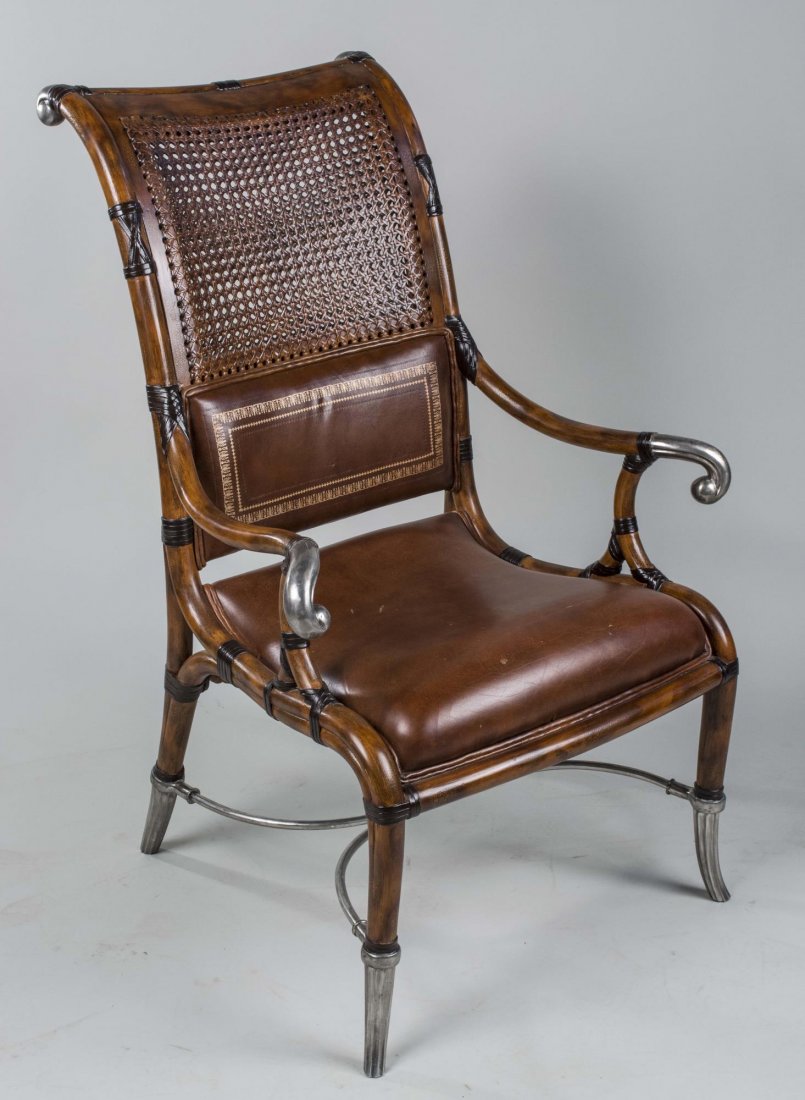 Maitland Smith Caned Back Chair: Parcel silvered chair with back scrolled crest rail and caned back, outscrolled open arms, upholstered seat on turned legs. Height 42 inches, width 27 inches, depth 27 inches. Notice to bidders: Condi