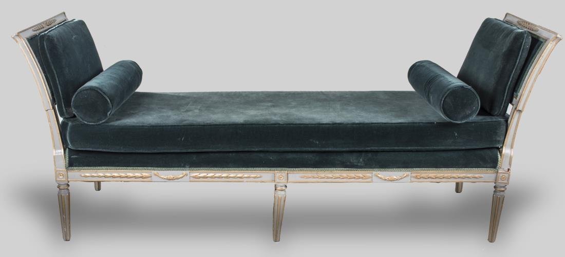 Daybed: Gray painted and parcel gilt frame, with green velour upholstered cushion and bolsters. Height 35 inches, width 29 inches, length 7 feet 2 inches. Notice to bidders: Condition reports and additional p