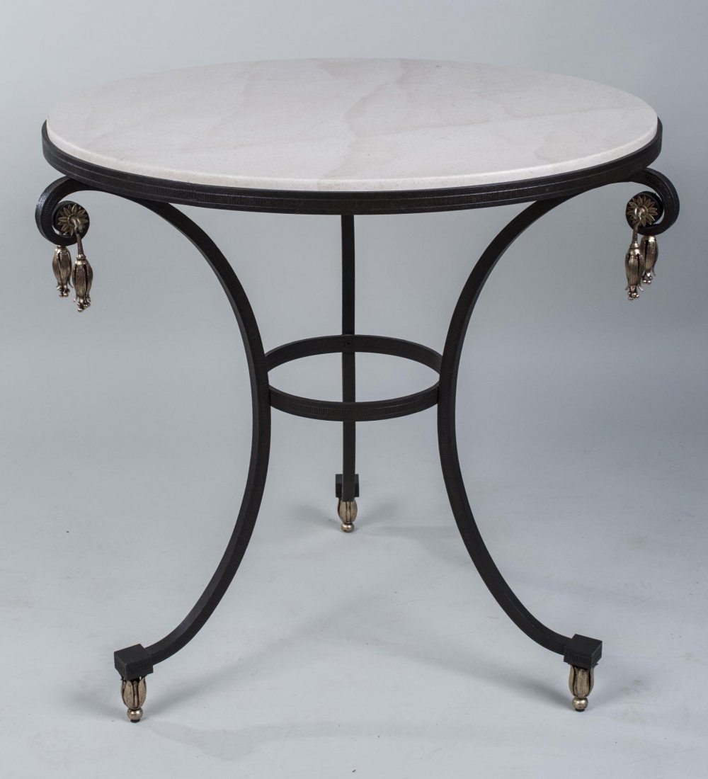 Marble Top Gueridon: Neoclassical style, circular white marble top on three black painted metal scrolled legs joined by a ring stretcher. Height 3 inches, diameter 36 inches. Notice to bidders: Condition reports and addit