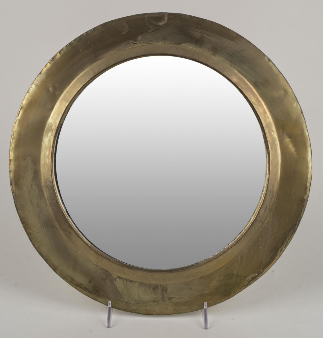 Brass Mirror: Circular brass frame. Diameter 15 1/2 inches. Notice to bidders: Condition reports and additional photographs are provided by request as a courtesy to our clients, as such any condition report is only