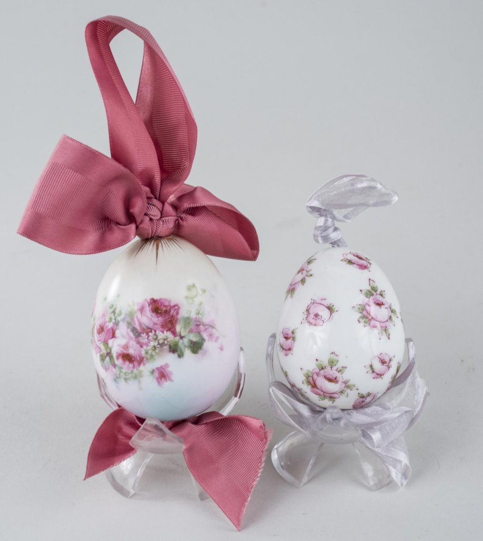 Two Russian Porcelain Easter Eggs: Each with pink flower decoration on a white ground. Larger, 2 3/4 inches. Provenance: From the Collection of Erwin A. Raible Notice to bidders: Condition reports and additional photographs are provide