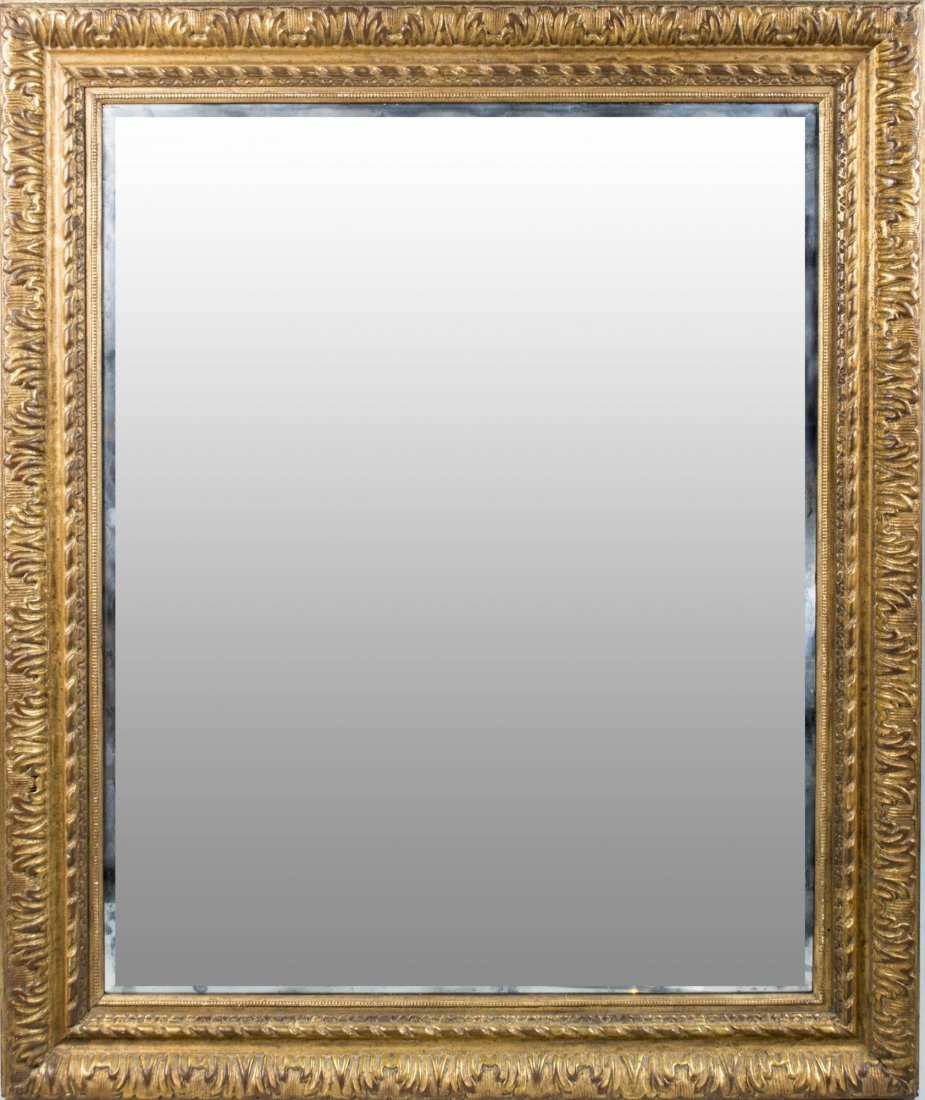 Hand Carved Gilt Wood Mirror: Rectangular beveled mirror plate. 51 x 43 inches. Notice to bidders: Condition reports and additional photographs are provided by request as a courtesy to our clients, as such any condition report is 