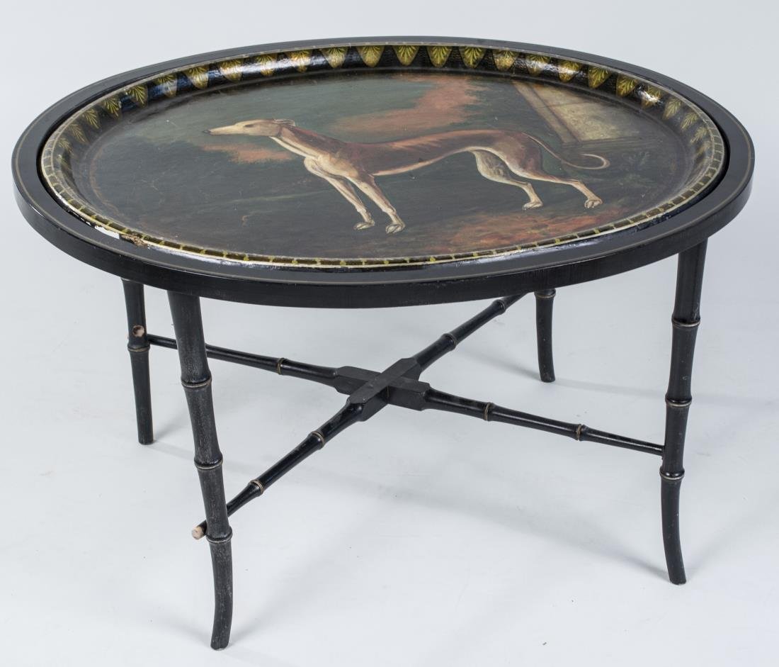 Papier Mache Tray Table: Oval, painted with a hound, on a black painted faux bamboo base with legs joined by an X stretcher. Height 19 inches, width 32 inches, depth 26 inches. Notice to bidders: Condition reports and additio