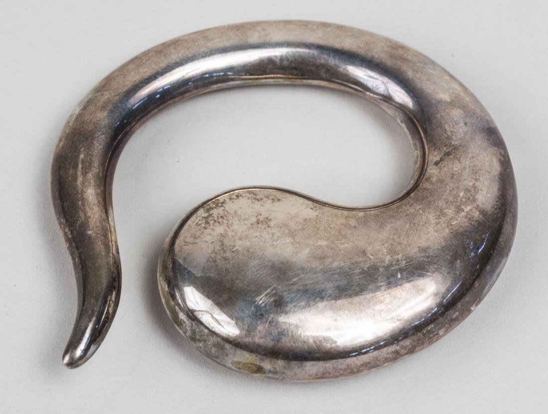 Elsa Peretti for Tiffany Sterling Silver Ornament: In the shaped of a tadpole. Notice to bidders: Condition reports and additional photographs are provided by request as a courtesy to our clients, as such any condition report is only an opinion and sh