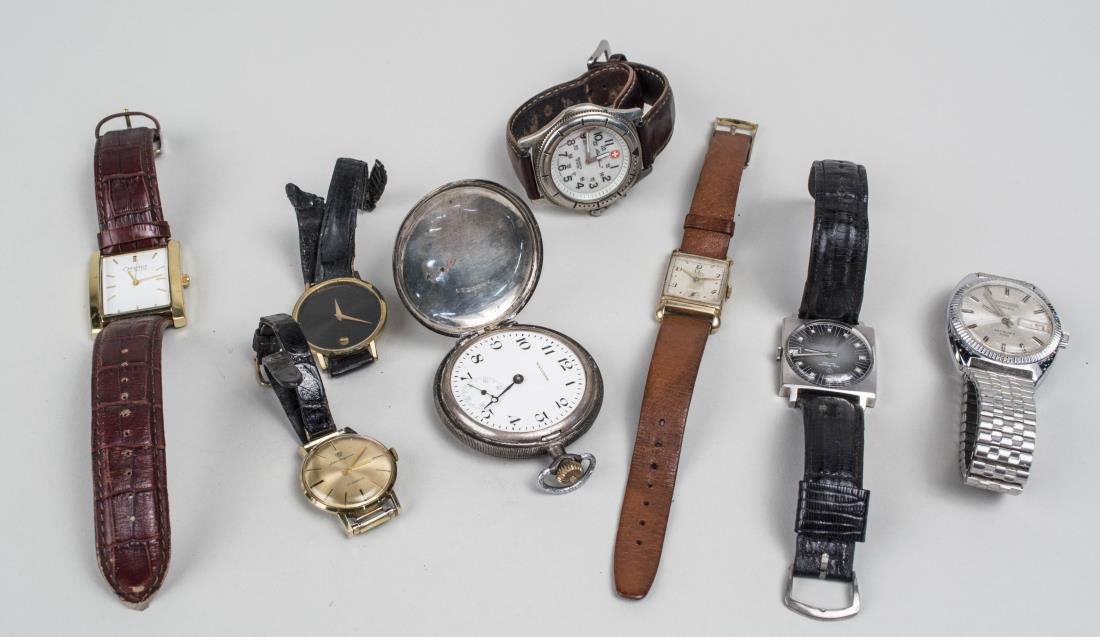 Group of Vintage Watches: Including a Waltham sterling silver pocket watch, an Omega gold filled tank style wristwatch, two Jules Jergensen, a Caravelle by Bulova, Eddie Bauer, Movado, Kronotron, etc. Notice to bidders: Condit