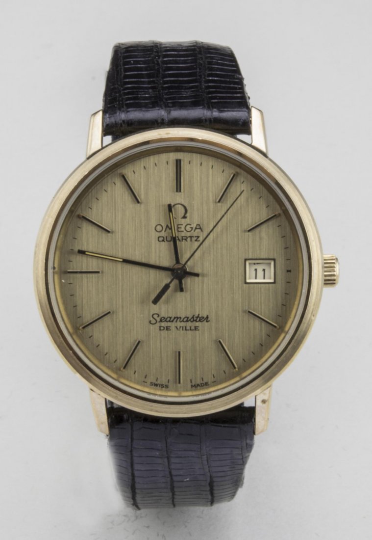 Omega Seamaster DeVille Quartz: 10k gold filled watch with gold tone dial with baton hours and date aperture, no.1342, black lizard band. Notice to bidders: Condition reports and additional photographs are provided by request as a c
