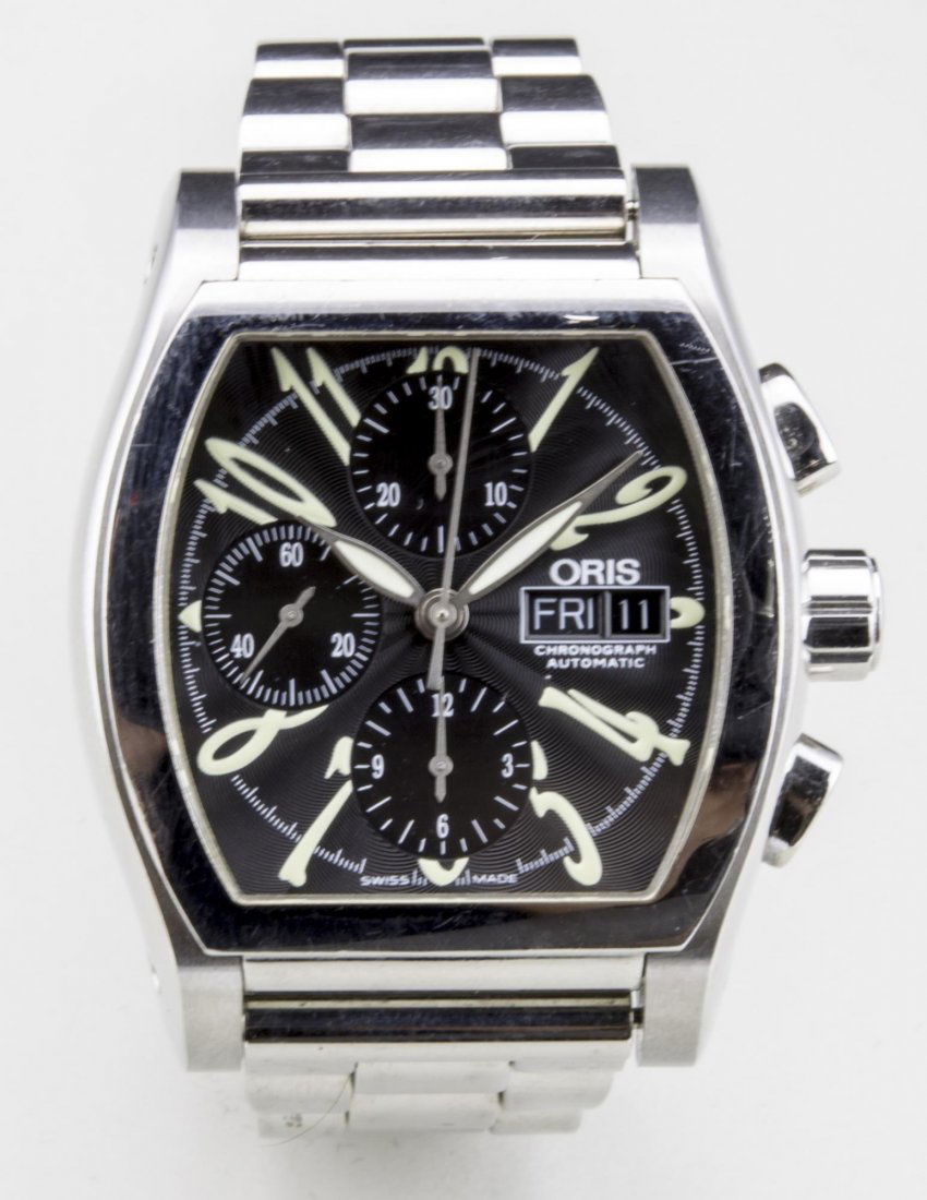 Oris Chronograph Automatic Watch: Stainless steel watch, black guilloche enamel dial with Arabic numerals and three subsidiary dials, date aperture, skeletonized back, no. 22 - 19160, stainless steel band. Notice to bidders: Condition