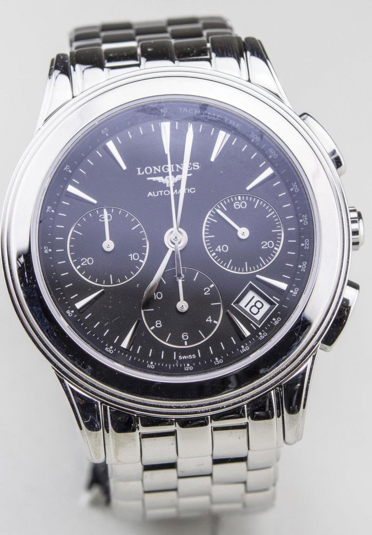 Longines Wristwatch: Black dial with baton hours and three subsidiary dials, # 03040224, stainless steel band, original box. Notice to bidders: Condition reports and additional photographs are provided by request as a cou