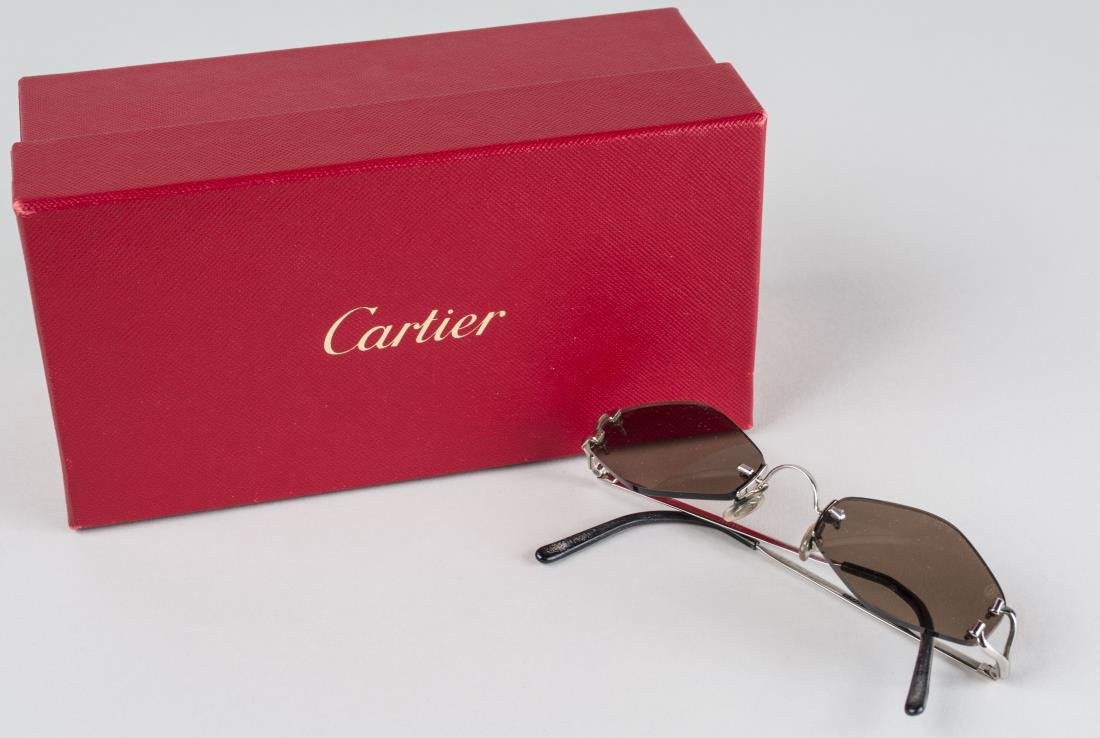Cartier Sunglasses *: Original box. Notice to bidders: Condition reports and additional photographs are provided by request as a courtesy to our clients, as such any condition report is only an opinion and should not be tr