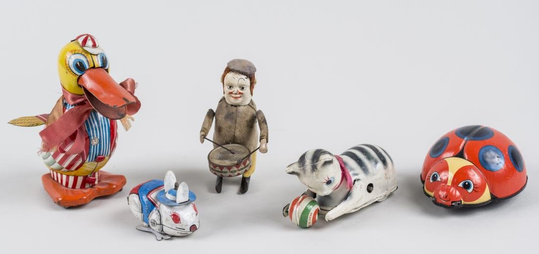 Group of Vintage Wind-Up Animal Tin Toys: Including a friction wind duck toy by Daito, a wind up Lady Bug toy by T.N., a cat with a ball, and a hopping rabbit; together with a vintage Schuco toy drummer. Notice to bidders: Condition reports a