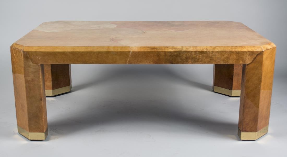 Karl Springer Parchment Coffee Table: Beveled rectangular top with cut corners, conforming legs, and brass feet. Height 18 inches, width 48 inches, depth 30 inches. Notice to bidders: Condition reports and additional photographs are provi
