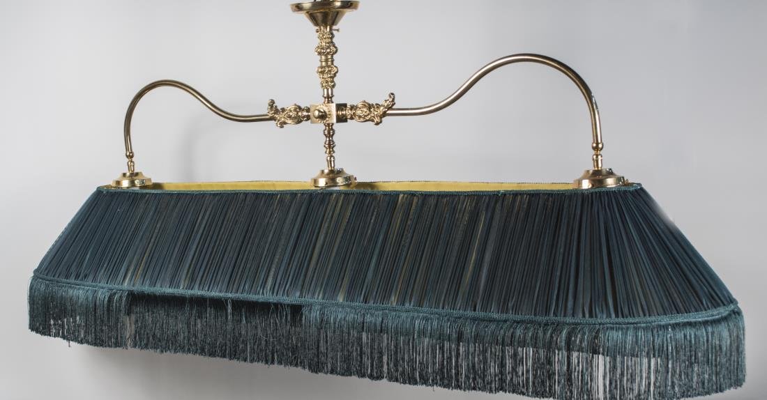 Brass Billiard Lamp: Three light fixture with two scrolled arms, green fabric shade. Height 36 inches, width 76 inches, depth 18 inches. Notice to bidders: Condition reports and additional photographs are provided by requ