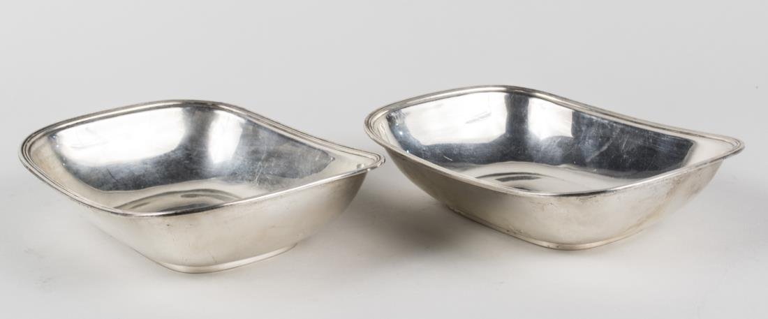 Pair of Tiffany & Co. Sterling Silver Bowls: Rectangular bowls with rounded corners, reeded edge an conforming ring foot. Height 2 1/4 inches, length 8 3/4 inches, total 920 grams. Notice to bidders: Condition reports and additional photographs