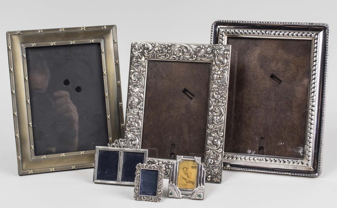 Five Decorative Frames: Including two sterling silver frames, a miniature double frame, etc. Notice to bidders: Condition reports and additional photographs are provided by request as a courtesy to our clients, as such any c