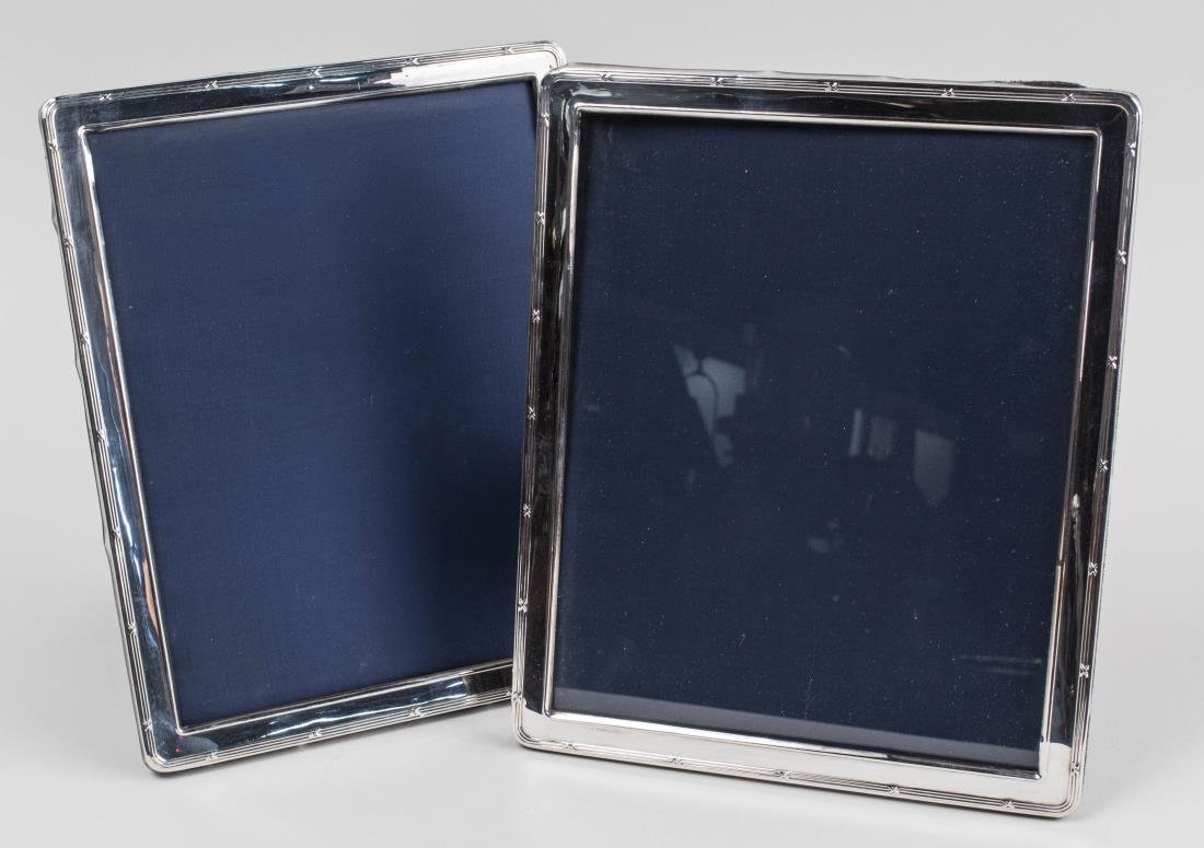 Pair of English Silver Picture Frames: Holds 8 x 10 photographs. Notice to bidders: Condition reports and additional photographs are provided by request as a courtesy to our clients, as such any condition report is only an opinion and shou