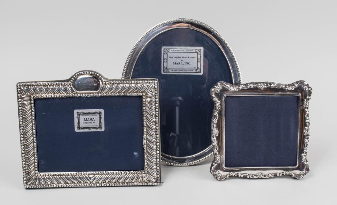 Three English Silver Picture Frames: One square, one rectangular and one oval picture frame. Notice to bidders: Condition reports and additional photographs are provided by request as a courtesy to our clients, as such any condition repo