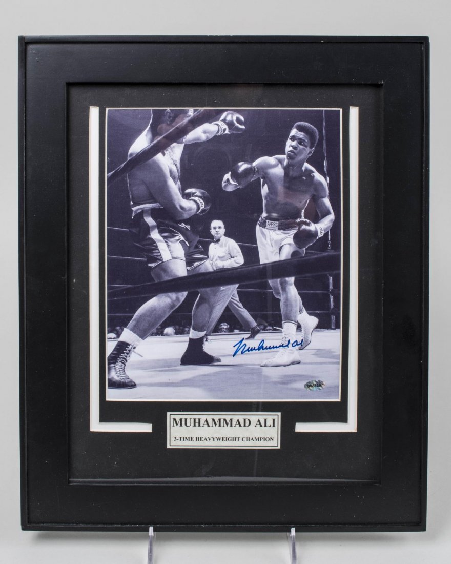 Muhammad Ali Signed Photo *: With certificate of authenticity, matted and framed. Sight size 10 x 8 inches, frame size 16 3/4 x 13 7/8 inches. Notice to bidders: Condition reports and additional photographs are provided by reques