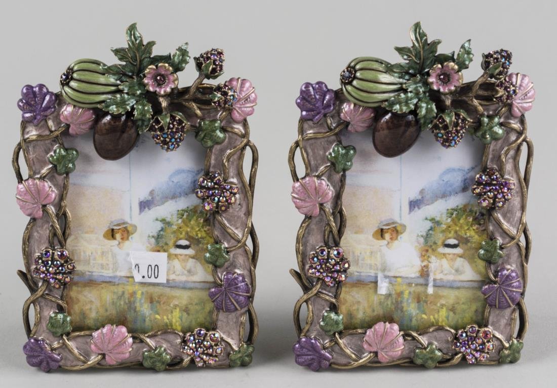 Pair of Jay Strongwater Picture Frames: Enamel decoration of fruiting vines, signed. Height 5 inches. Notice to bidders: Condition reports and additional photographs are provided by request as a courtesy to our clients, as such any conditio