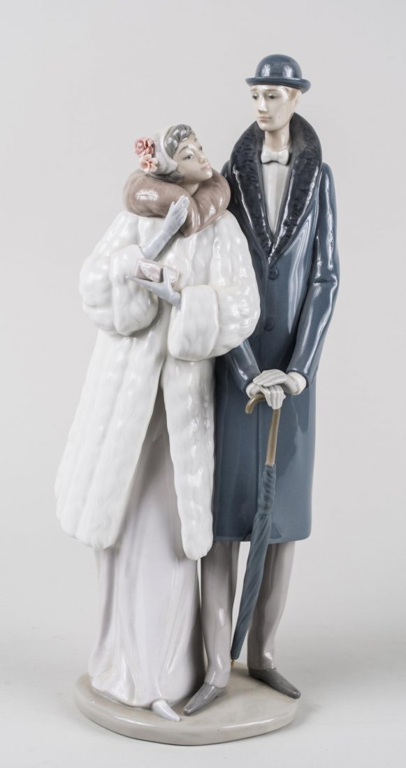 Lladro Porcelain Figure: On the Town, number 1452, sculpted by Jose Puche, issued in 1983 and retired in 1994. Height 14 1/2 inches. Notice to bidders: Condition reports and additional photographs are provided by request as a