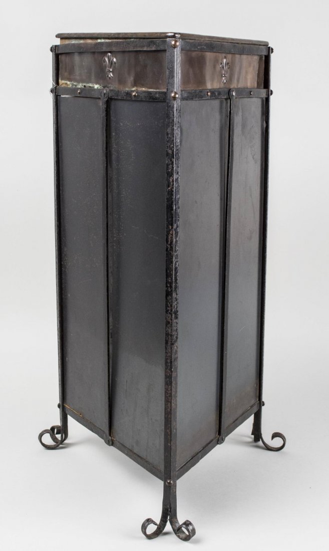 Arts & Crafts Metal Umbrella Stand: Black painted metal, triangular form. Height 25 inches, width 11 inches, depth 11 inches. Notice to bidders: Condition reports and additional photographs are provided by request as a courtesy to our c