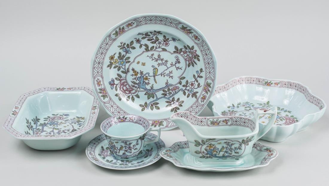 Adams English Ironstone Partial Dinner Service: Approximately forty three pieces, Calyx Ware, Singapore Bird pattern, including cups, saucers, plates, dishes, a sauceboat, etc. Largest plate diameter 10 1/4 inches. Notice to bidders: Condition repo