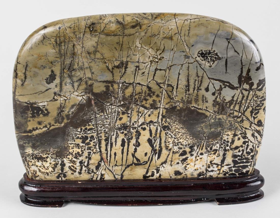 Landscape Agate Scholar's Rock: On a carved wood stand. Height 6 inches, width 9 inches. Notice to bidders: Condition reports and additional photographs are provided by request as a courtesy to our clients, as such any condition rep