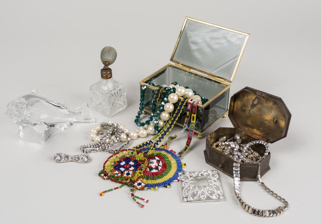 Group of Costume Jewelry: Including rhinestone necklaces, earrings and sweater pins, simulated pearl necklace, etc., together with dresser box and parfume atomizer. Notice to bidders: Condition reports and additional photograp