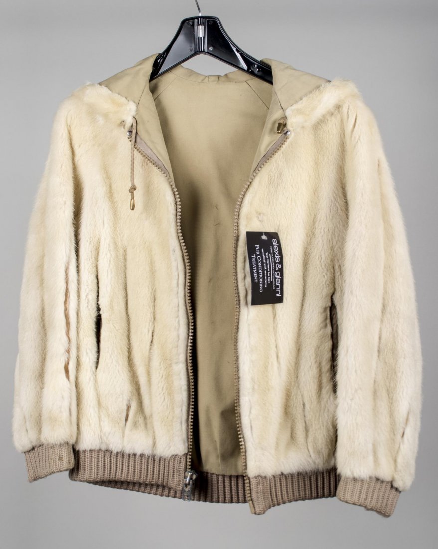 Fur Coat: Light colored fur bomber jacket, size small. Notice to bidders: Condition reports and additional photographs are provided by request as a courtesy to our clients, as such any condition report is only 