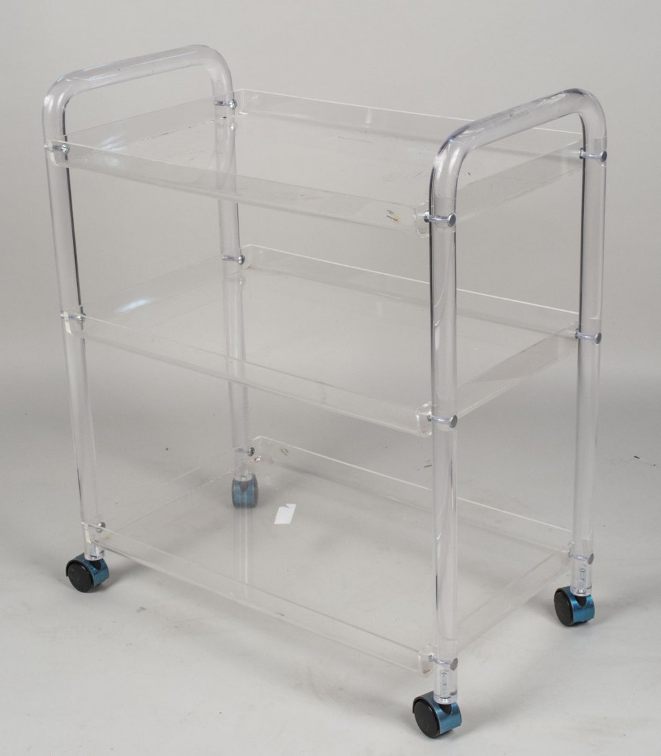 Lucite Tea Cart: Three tiered cart on wheels. Height 32 inches, width 28 inches, depth 16 inches. Notice to bidders: Condition reports and additional photographs are provided by request as a courtesy to our clients, a
