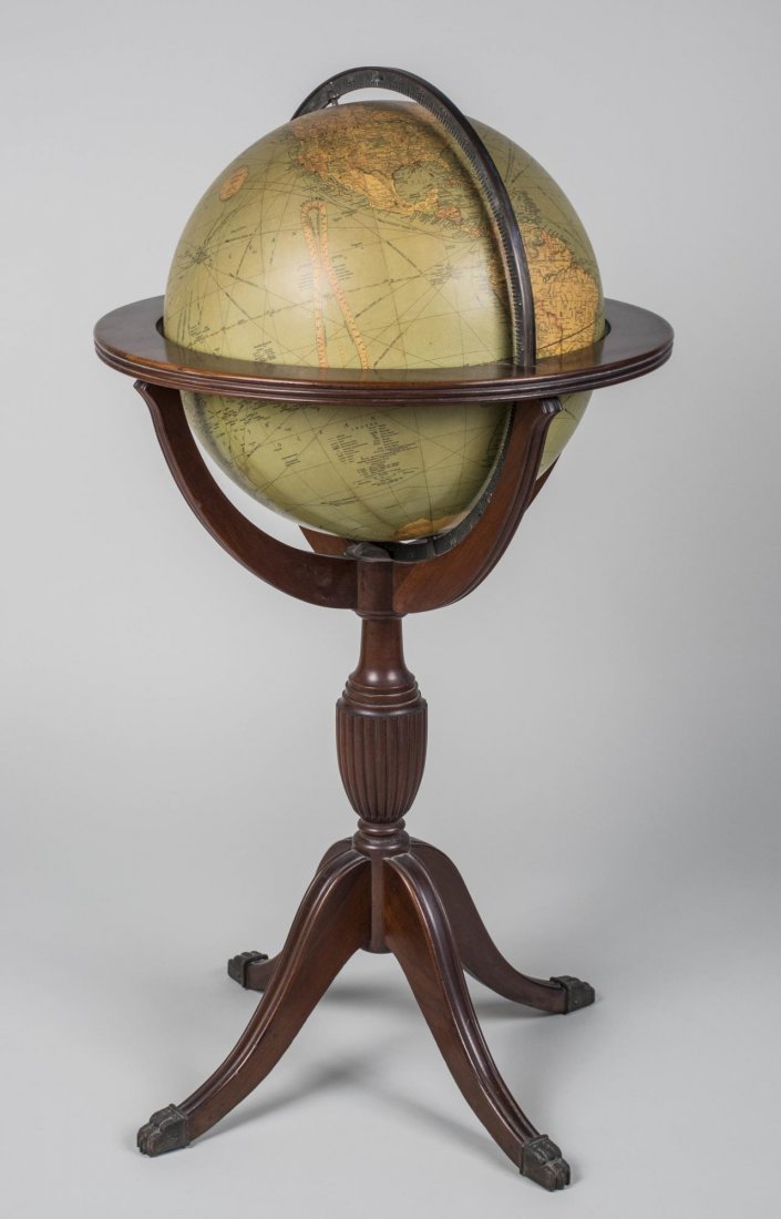 Reploge Library Globe: 16 inch world globe on a wood stand. Height 41 inches, diameter 24 inches. Notice to bidders: Condition reports and additional photographs are provided by request as a courtesy to our clients, as such